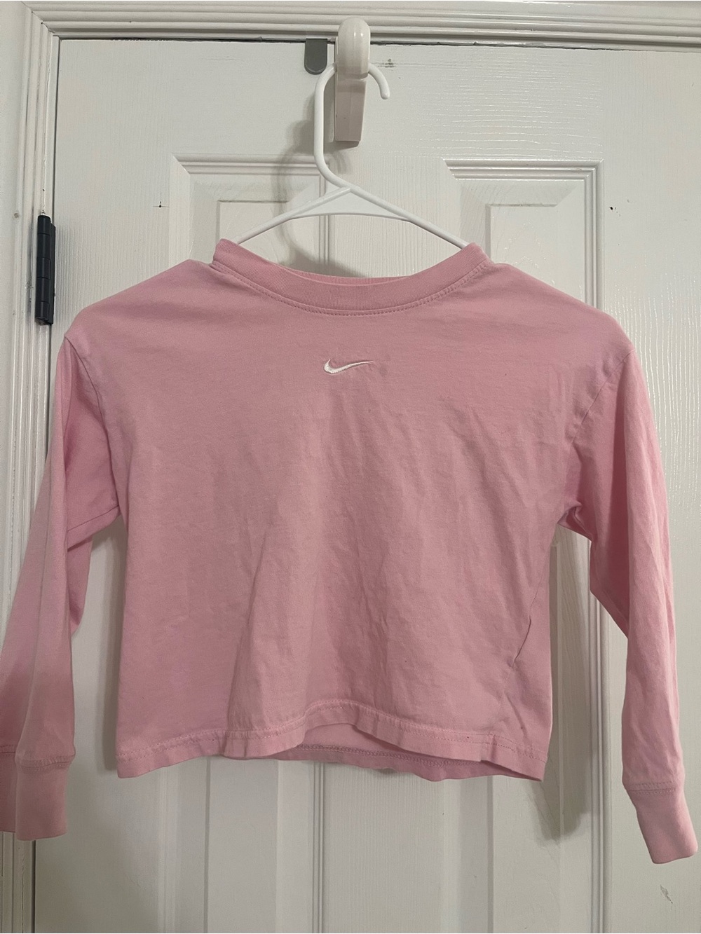Nike Light Pink Cropped Long Sleeve Top with White Swoosh